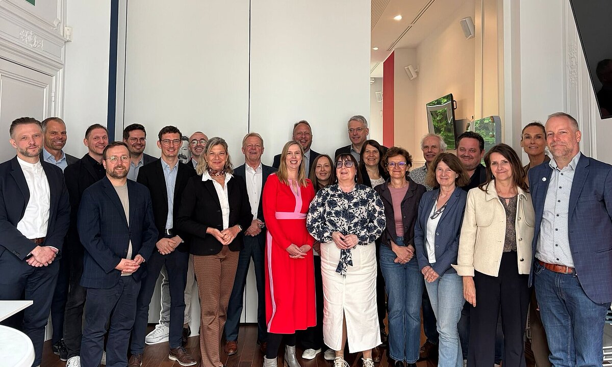 Group pictures of representatives from the Friedrich-Ebert-Stiftung (FES) and European trade union confederations in Brussels.