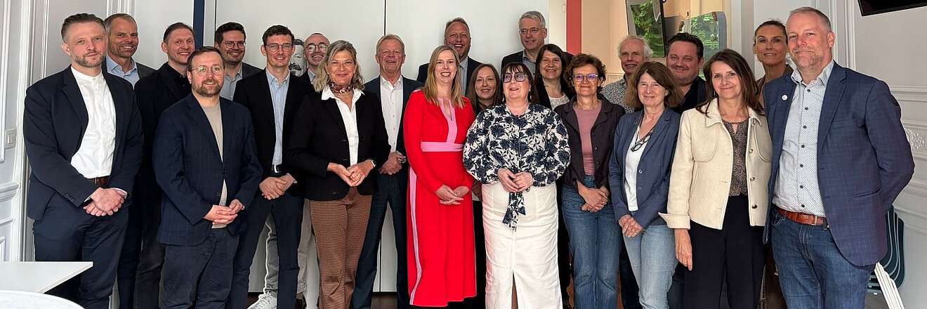 Group pictures of representatives from the Friedrich-Ebert-Stiftung (FES) and European trade union confederations in Brussels.