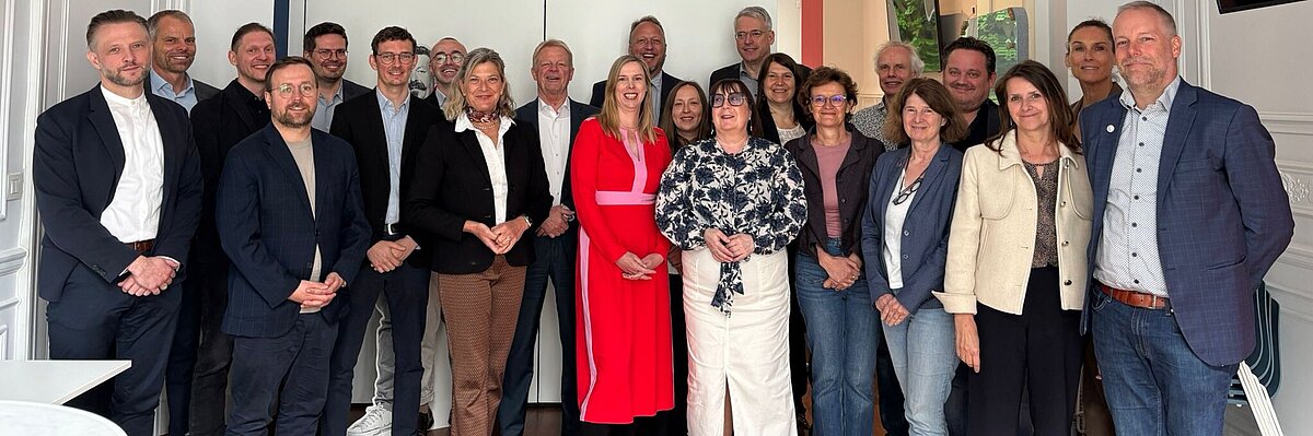 Group pictures of representatives from the Friedrich-Ebert-Stiftung (FES) and European trade union confederations in Brussels.