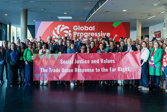 Group picture with a banner "Social Justice and Values - The Trade Union response to the Far Right"
