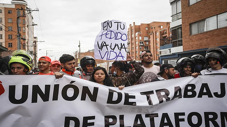 Several dozen food delivery people from the Colombian platform "Rappi" stage a demonstration demanding better working conditions and social guarantees, as well as fairer rates in Bogota, Colombia on March 02, 2022
