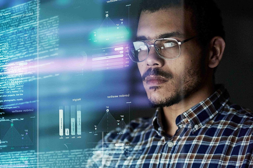 Cover of the study showing a man working on a laptop, with lines of codes in the background.