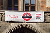 Equal Pay Day advertising by the town hall in Munich, Bavaria, Germany, on February 26, 2026, marks the day before the official opening. Equal Pay Day on February 27 symbolically marks the gender pay gap, as women in Germany earn 16 percent less than men in 2024 according to official statistics. 