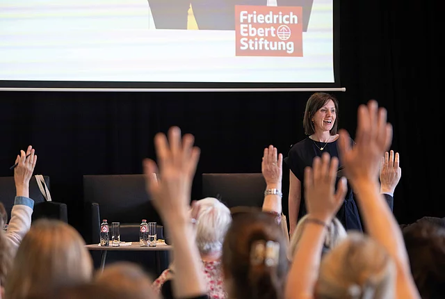 Audience raising their hands