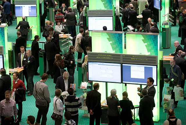 DEU, Deutschland, Germany, Hannover, 04.03.2011 Besucher am Messestand der Firma Datev uf der Computermesse und Technologiemesse Cebit 2011 in Hannover. Vernetzung, digitaler Austauch, Messe, Praesentation, Handel, digital, Internet, wireless lane, wifi, IT, High Tech, Computerindustrie, Multimedia, Computermesse, Telekommunikation, Messen, Messe, Messestand, Ausstellungen, Kommunikation, Wirtschaft, Symbol, Symbolbild, symbolisch, Elektronik, Technik, Technologie, Informationstechnologie, Unterhaltung, Unternehmen. Visitors passing a stand of the company Datev the world's biggest high-tech fair, Computer Fair, Cebit 2011 in Hanover, Lower Saxony. More than 4,200 tech firms from 70 countries will display the latest in information and communications technology during the fair. Trade Fair, Economy, Business, Germany, Information Technology, Company, Phone, Telecommunications, Communikation, Electronic, Consumer Goods Industry, High Tech, Presentation, Trade, Trading, technology fair, Symbol, symbolic photo, digital, Internet, logo 