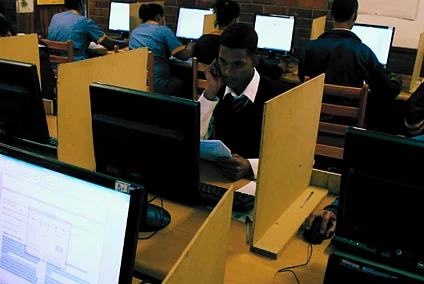 Students use computers to study at Elswood Secondary School in Cape Town 