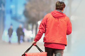 a delivery worker from behind