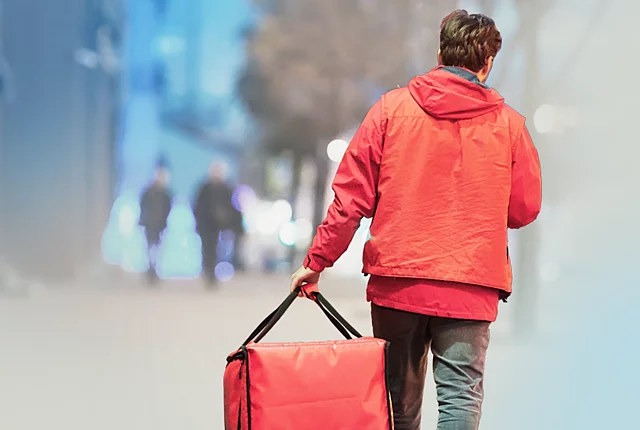 a delivery worker from behind